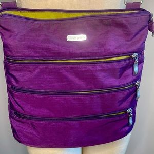 Baggalini big zipper crossbody bag. Removable wristlet. Purple/green interior